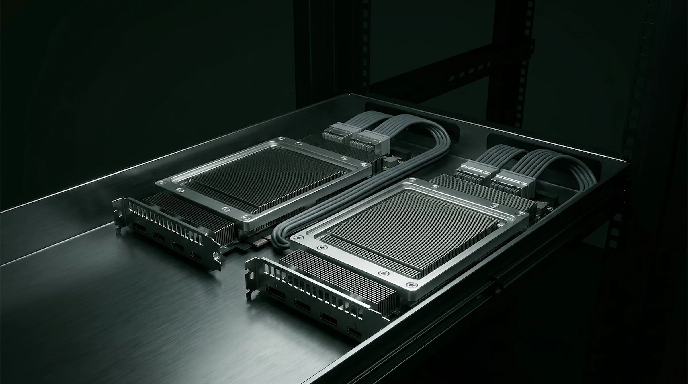Two NVIDIA Hopper accelerator modules joined by NVLink bridge cables on a brushed-metal rack shelf