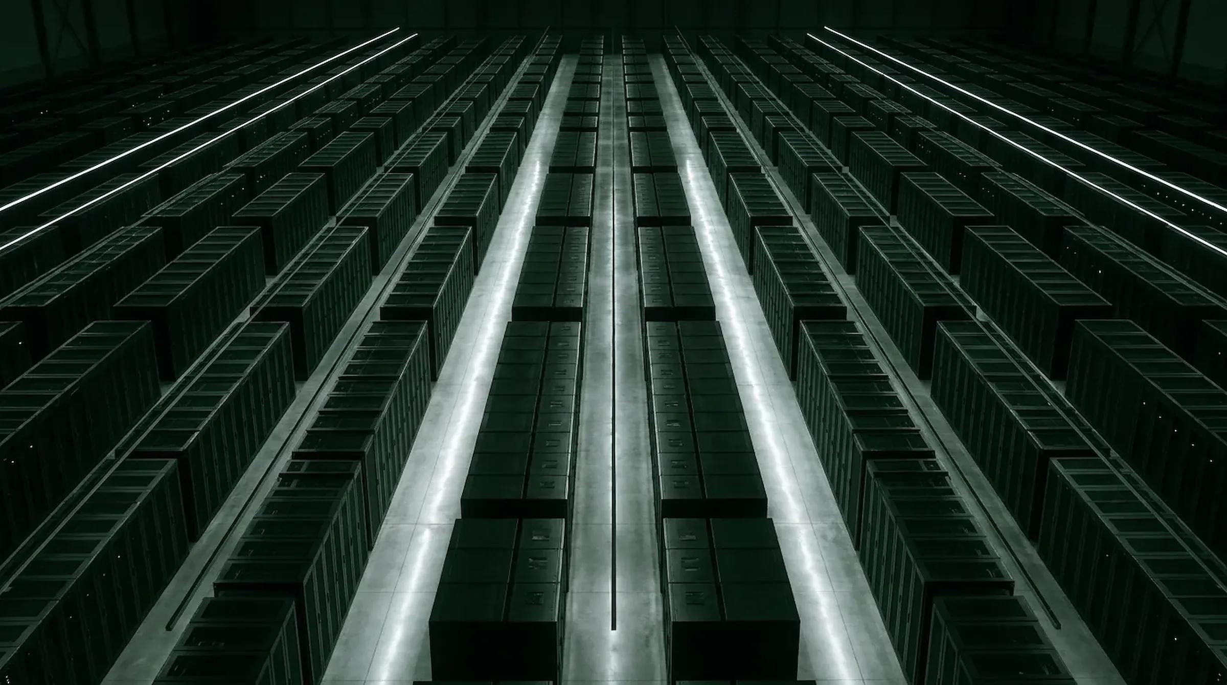 Rows of GPU compute racks receding across a dark data hall